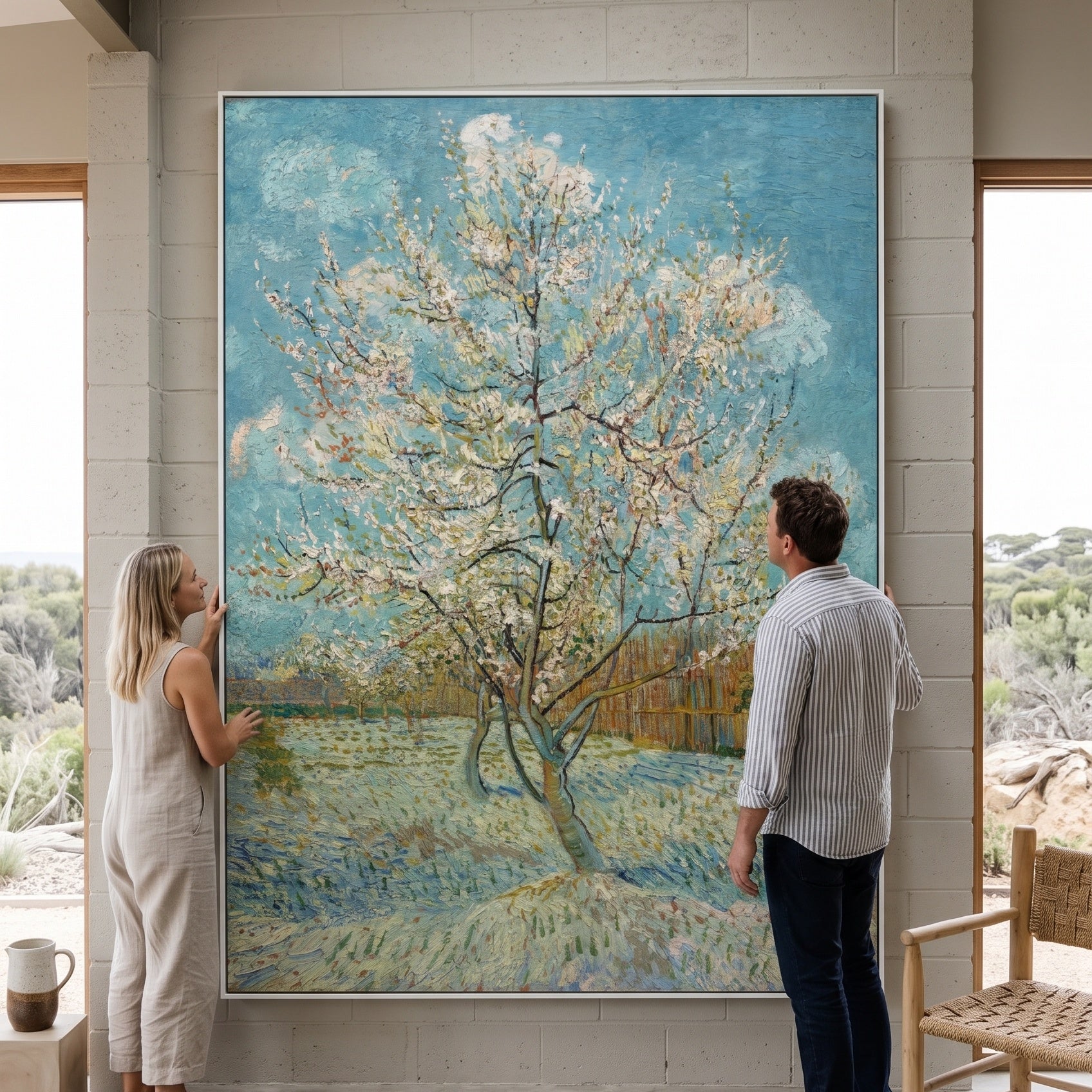 The Pink Peach Tree by Vincent van Gogh — large light blue and green Impressionist canvas art on a living room wall