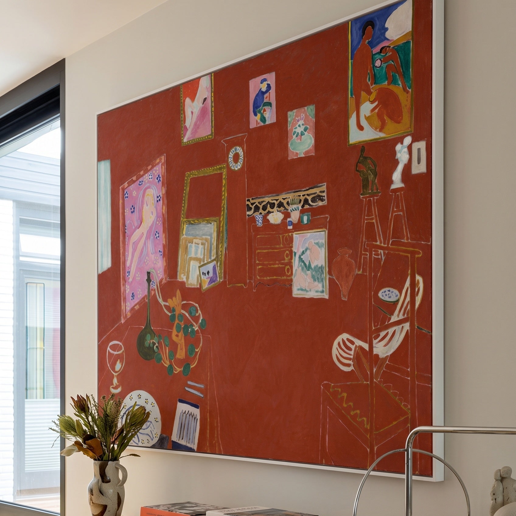 The Red Studio by Henri Matisse — large red Modern Abstract canvas art on a living room wall