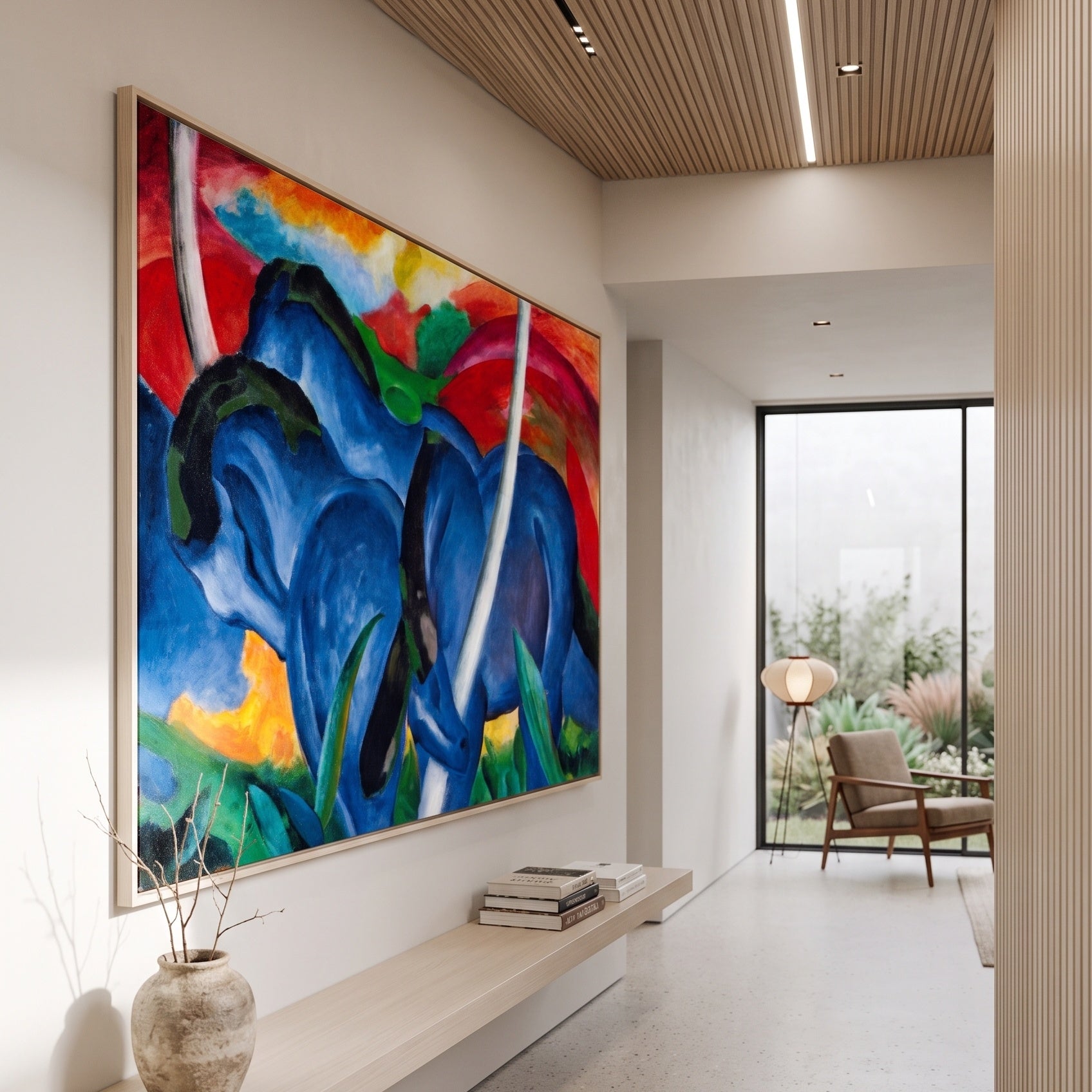 The Large Blue Horses by Franz Marc — large blue and red Expressionist Abstract canvas art on a hallway wall