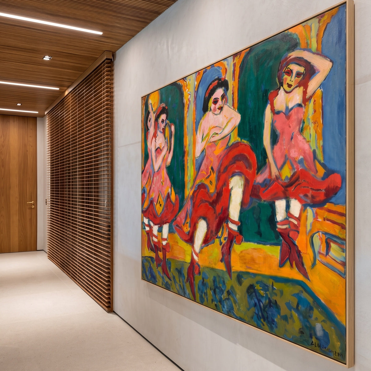 Czardas Dancers by Ernst Ludwig Kirchner — large red and orange Expressionist canvas art on a hallway wall