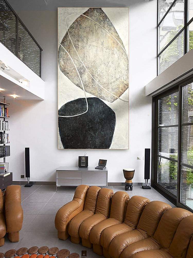 Stone Balance Black & White Abstract canvas wall art framed and hung on a wall