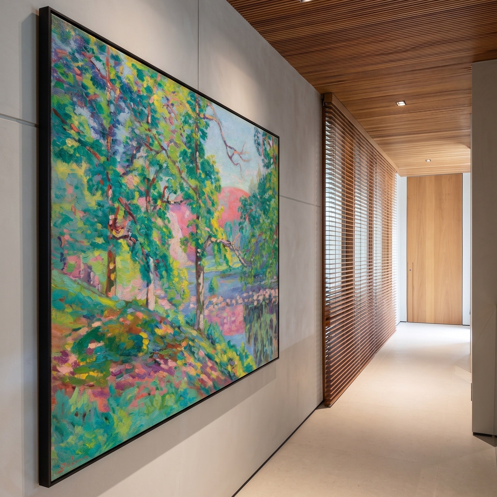 Les Bords de la Creuse by Armand Guillaumin — large green and pink Impressionist canvas art on a hallway wall