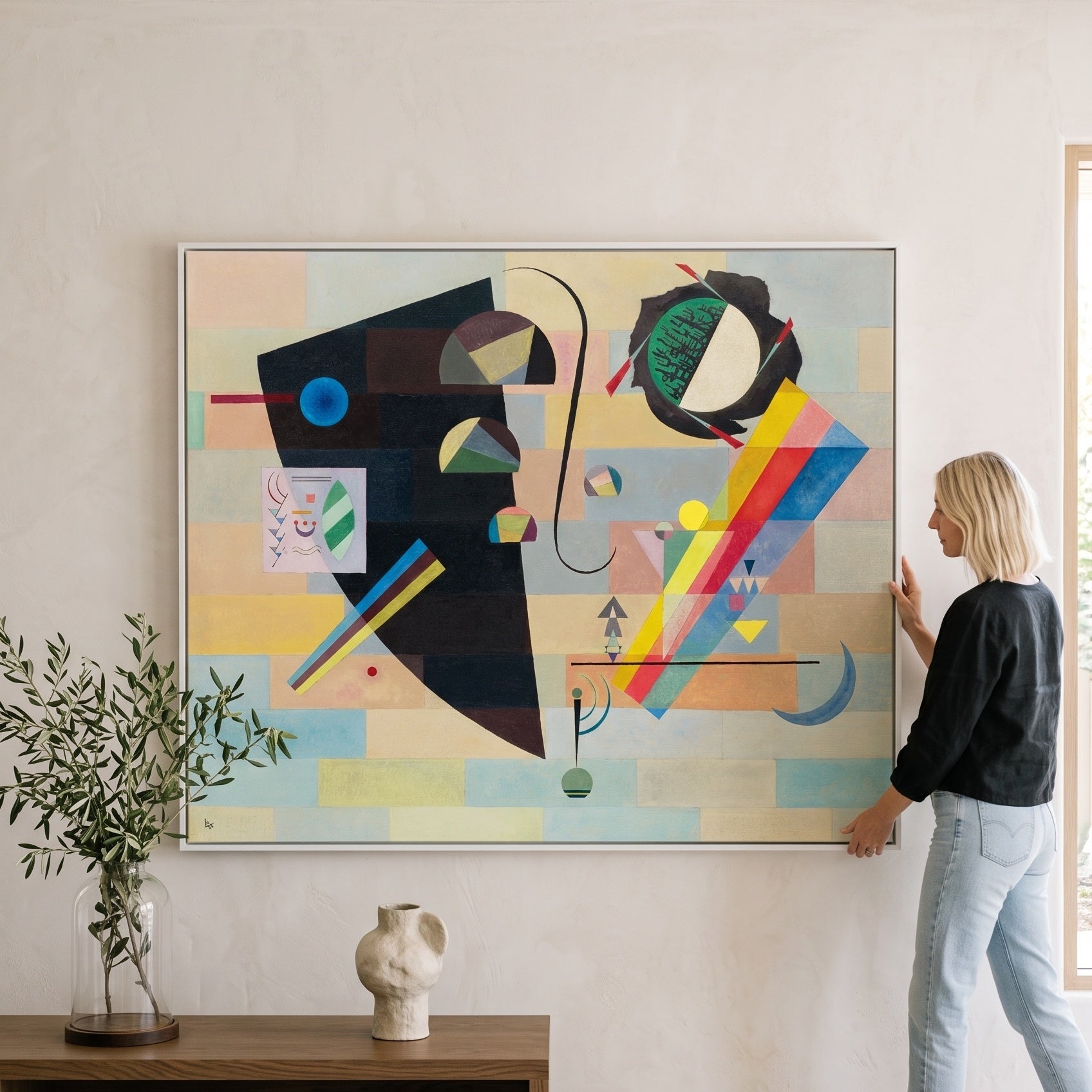 Black Form with Rainbow Band by Wassily Kandinsky — large black and white Abstract canvas art on a living room wall
