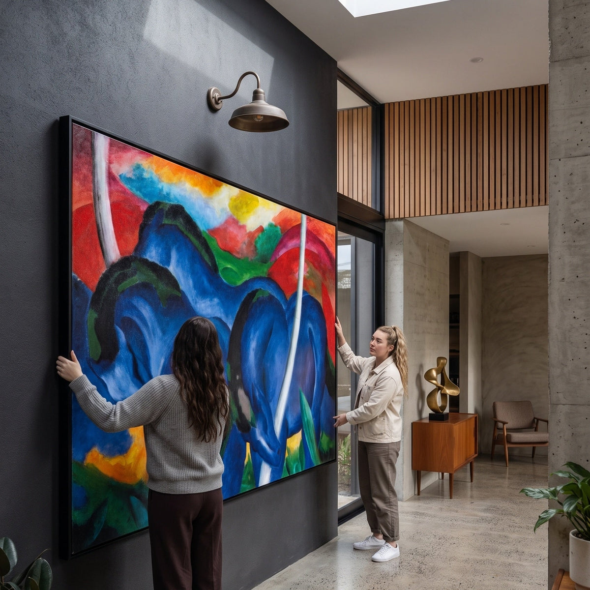 The Large Blue Horses by Franz Marc — large blue and red Expressionist Abstract canvas art on a entryway wall